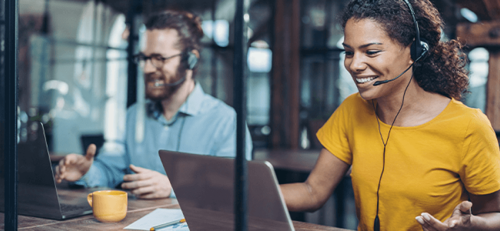 People on Laptop With Headset